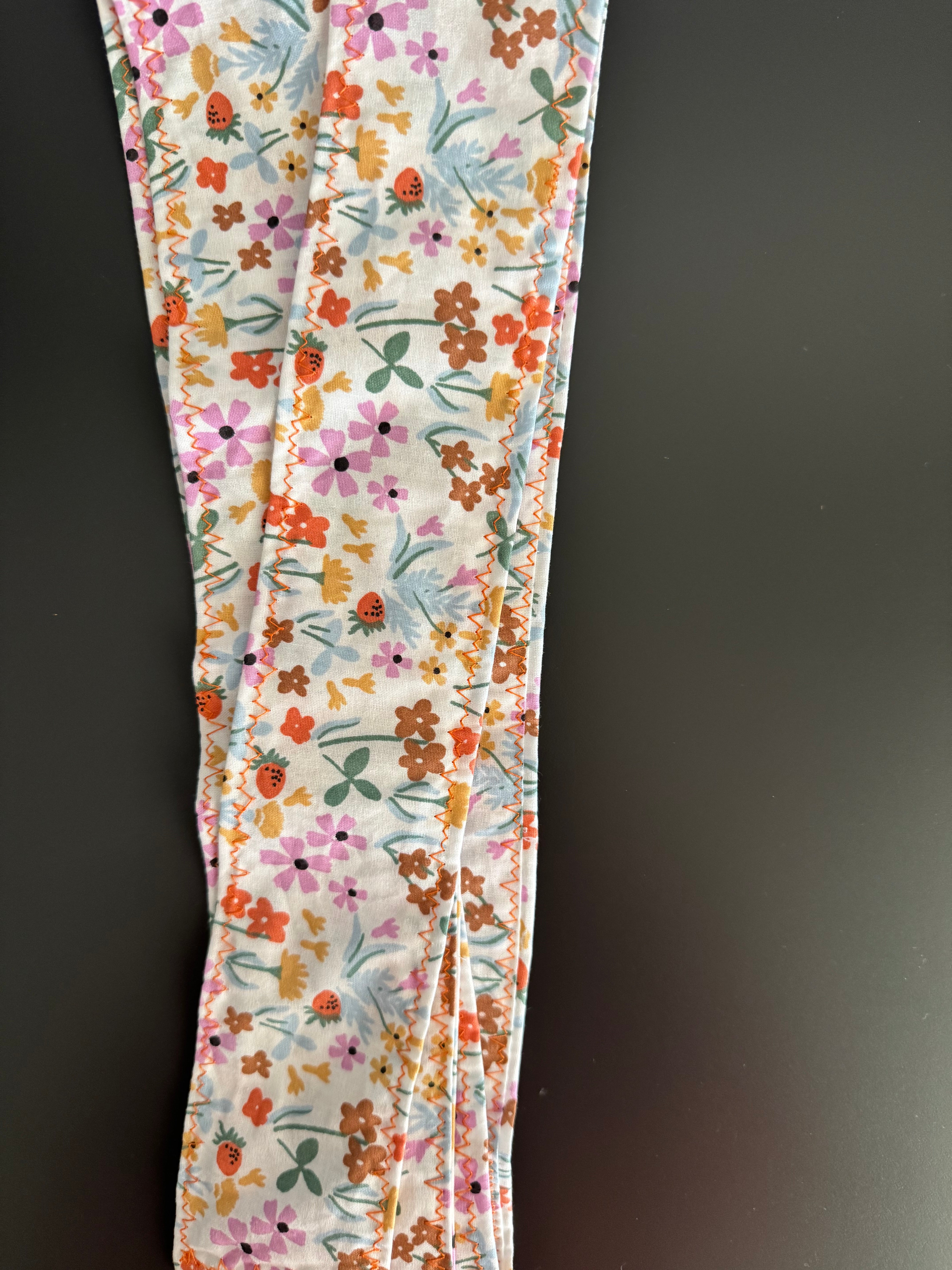 Pamela Audrey beige con cinta de flores